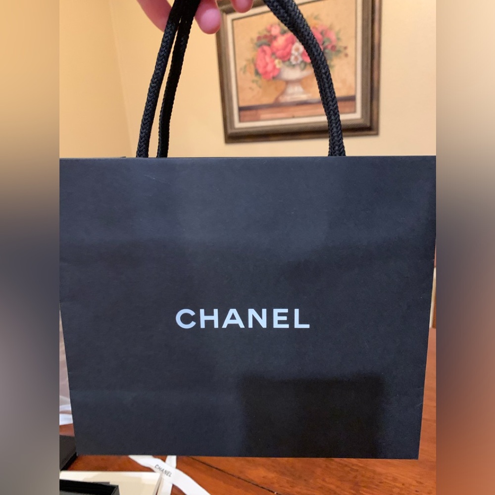 Beautiful and authentic, rare and collectible Chanel shopping bag w/ fabric held